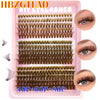 Un plateau rose d'extensions de faux cils naturels et fins dans diverses nuances et longueurs.