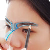 A close-up of a woman's eye showing an eyebrow shaping stencil being applied with a pencil.