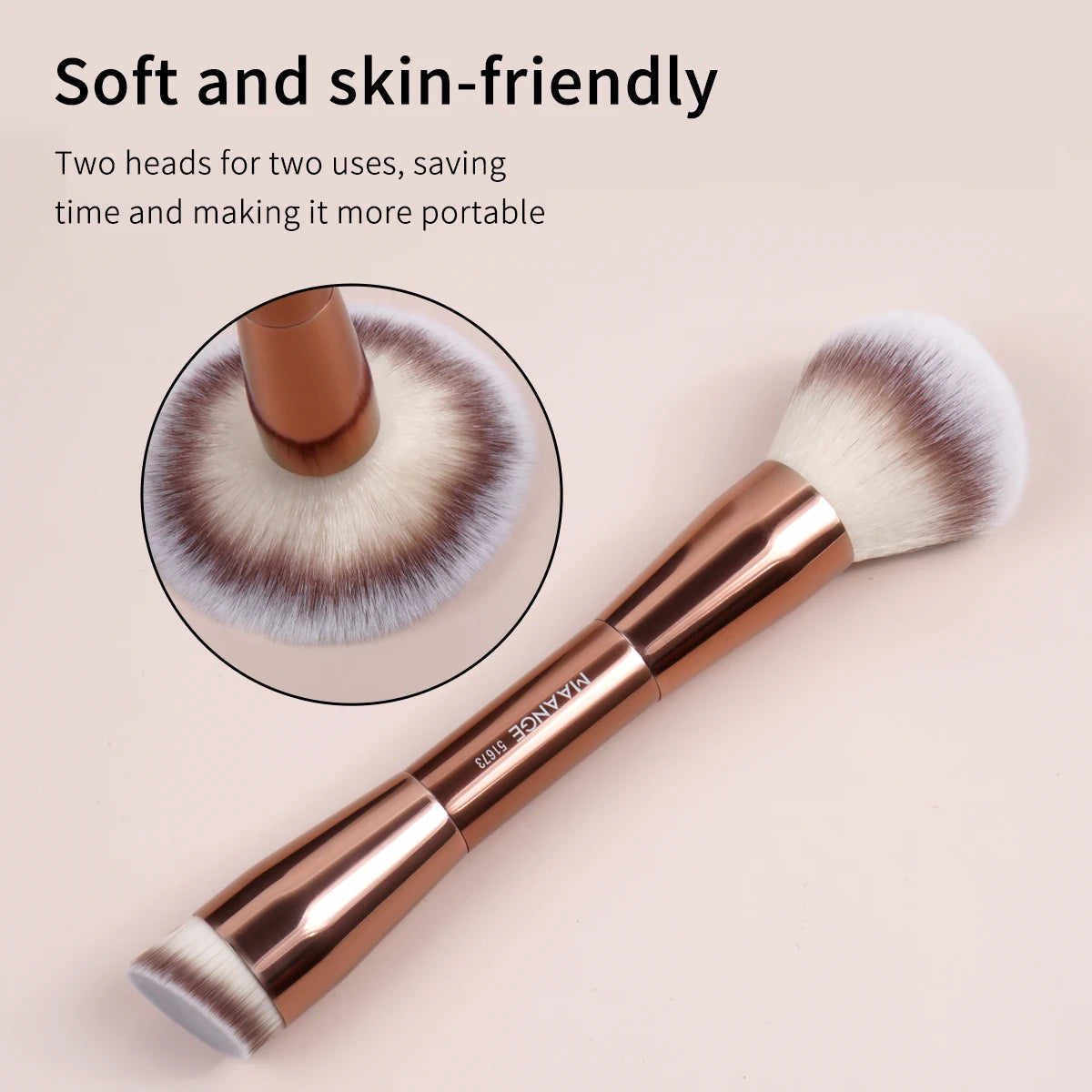 A close-up of a single, soft, fluffy makeup brush with a rose gold handle and light gray bristles.