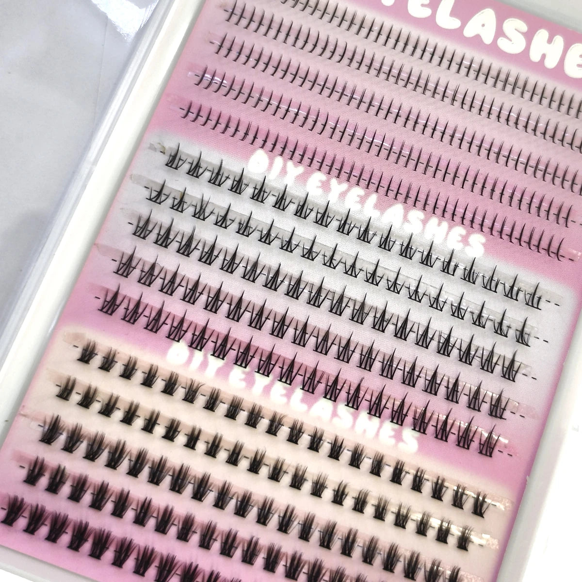 A close-up of a product sheet showing various rows of DIY wispy extension eyelashes.