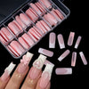A collection of nude pink matte French press on nails displayed in a clear plastic container and on a hand.