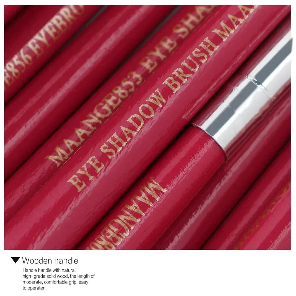 A close-up of a set of red makeup brushes with gold lettering on the handle.