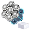 A silver electric shaver head with multiple rotating blades floating above a blue and black surface.