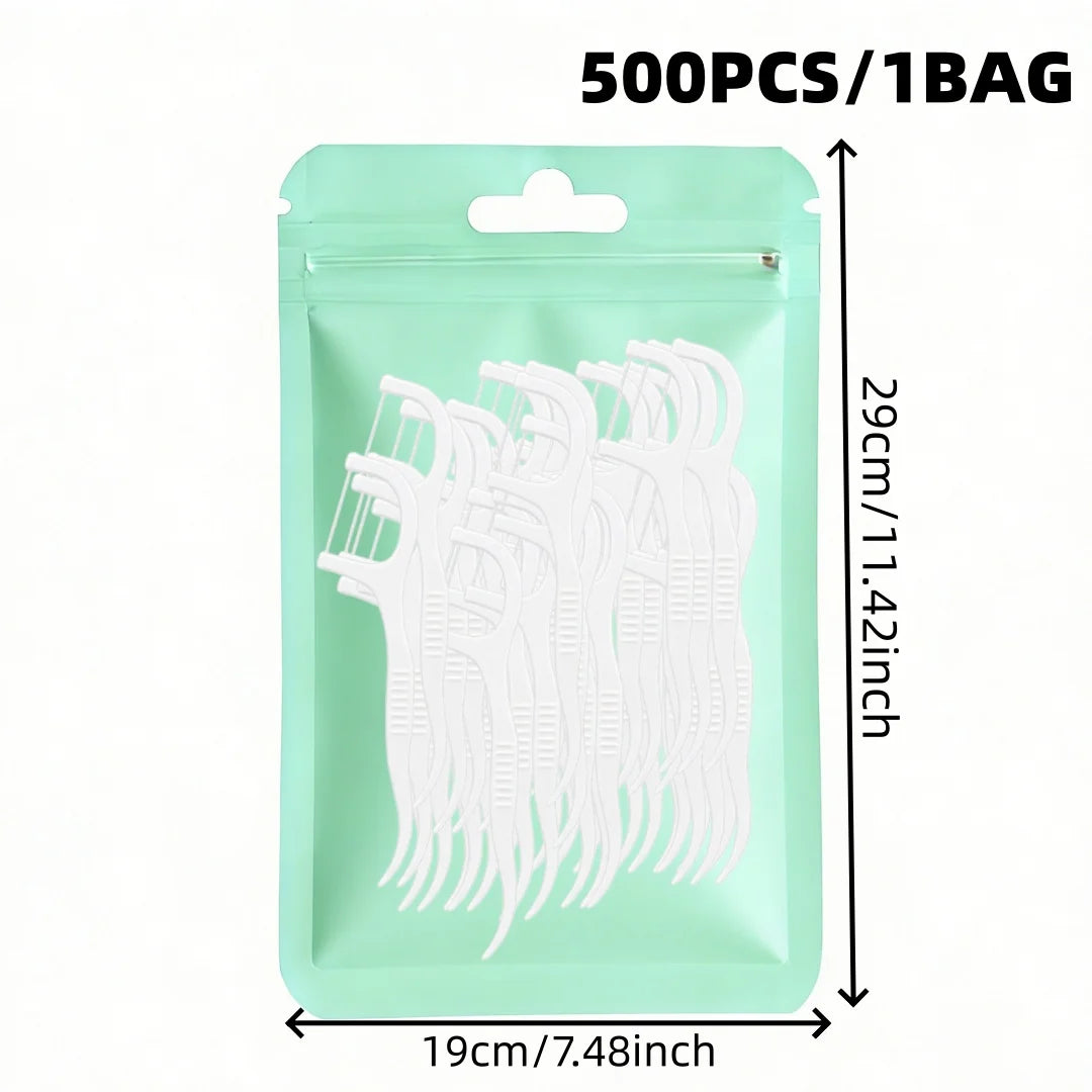 A package of 500 reusable dental floss picks in a light mint green bag.