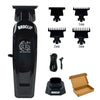 A black electric hair clipper with various guard attachments and accessories for trimming.