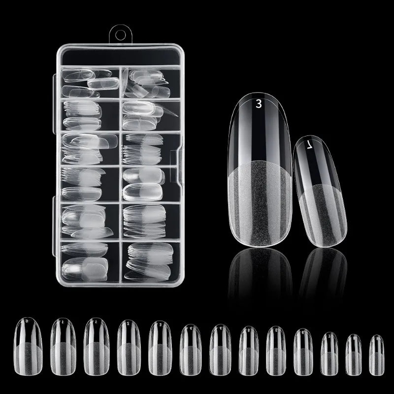 A collection of frosted French false nails in various natural finishes displayed in a clear plastic container.