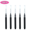 A set of five mini brow and eyelash combs in black.