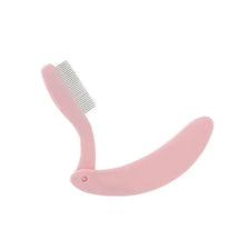 A pink foldable stainless steel comb set for eyelashes and eyebrows.
