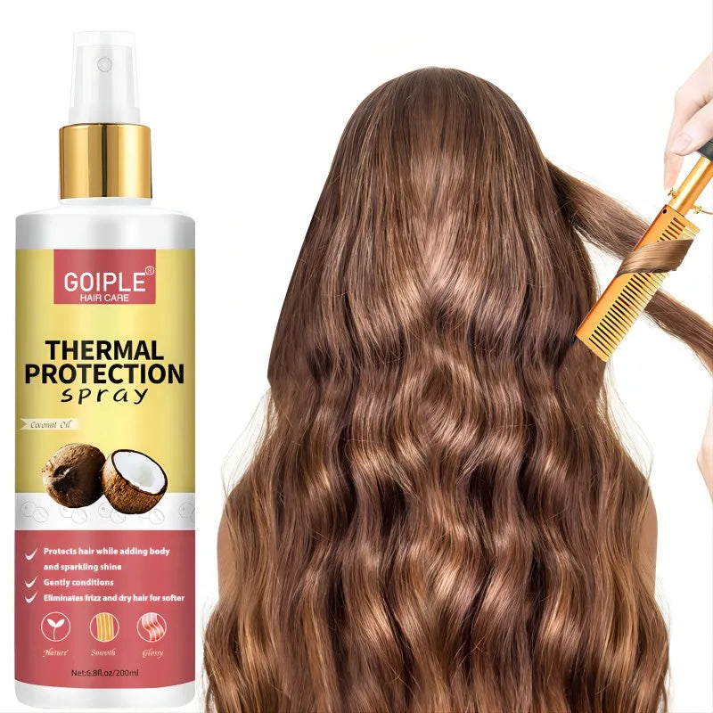 A bottle of Goiple Thermal Protection Spray next to long brown hair being styled with a gold-colored brush.