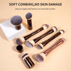 A set of soft, fluffy makeup brushes for foundation and eyeshadow application displayed on a light background.