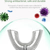 A close-up view of a silicone toothbrush head designed for dentures, shown within a clear sphere.