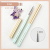 A set of professional nail art brushes with gold and light blue handles and a purple flower cap.