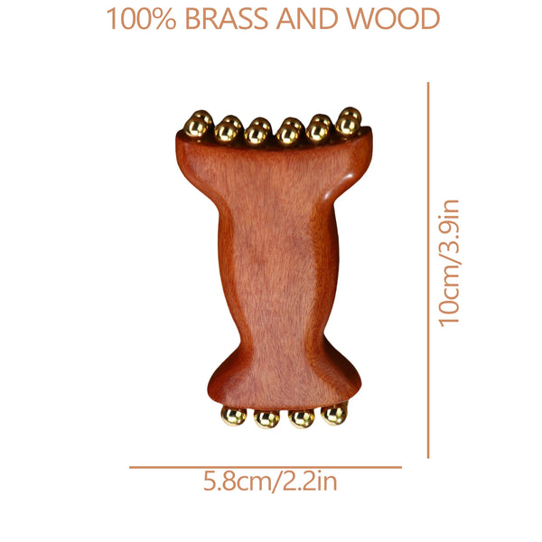 A wooden facial and scalp massage comb with brass accents.