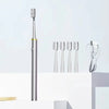 A silver sonic electric toothbrush with a white brush head is displayed vertically on a white surface.