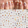 Close-up of fingers displaying various watercolor mushroom nail art designs on manicured nails.
