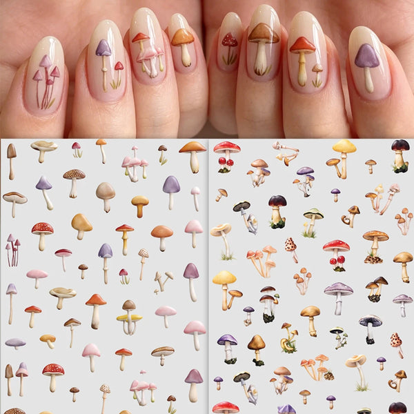 Close-up of fingers displaying various watercolor mushroom nail art designs on manicured nails.