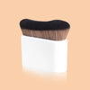 A pro-grade contour foundation brush with angled wavy bristles shown against a light background.