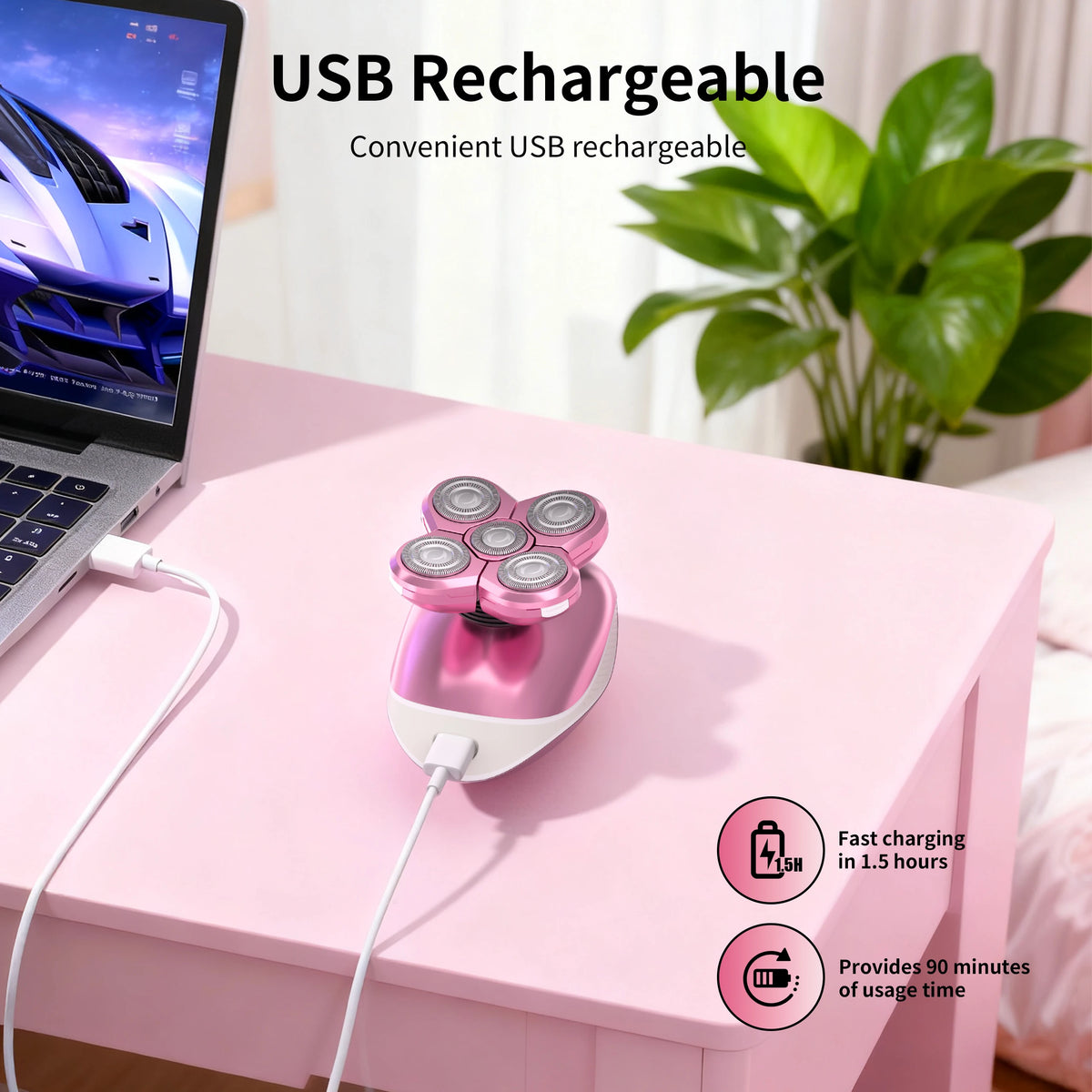 Pink USB rechargeable electric body hair removal shaver resting on a pink table next to a laptop.