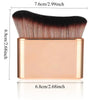 A precision hand-held foundation makeup brush with a gold-toned handle and dark bristles.