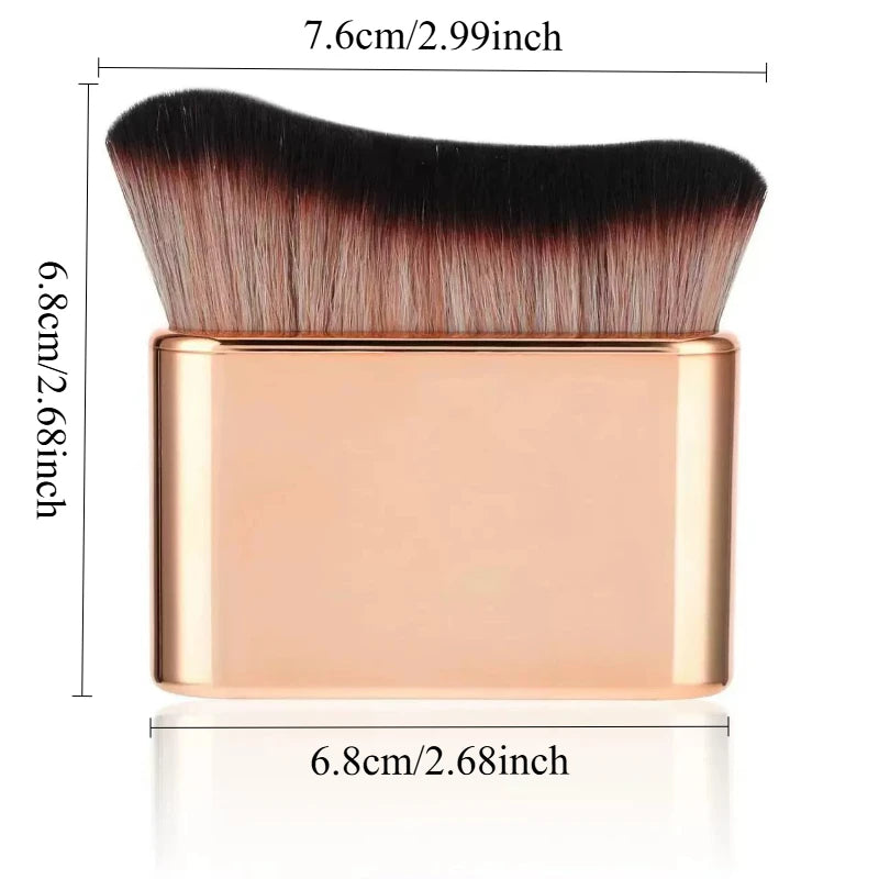 A precision hand-held foundation makeup brush with a gold-toned handle and dark bristles.