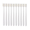 A set of ten white ultra-fine bristle toothbrushes arranged in a row.
