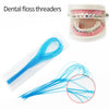 Reusable dental floss threaders shown as a clear plastic tool and a close-up of the fine blue threads.