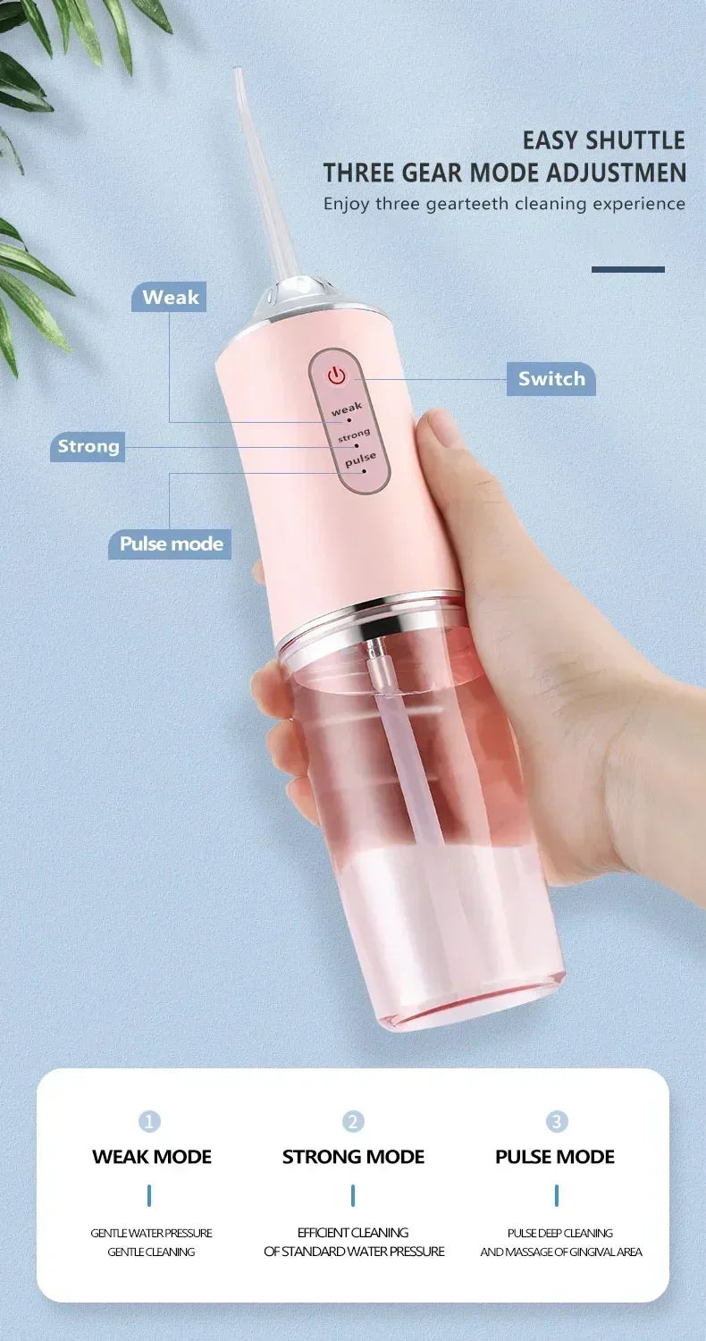 A hand holds a pink portable dental water flosser demonstrating weak, strong, and pulse cleaning modes.