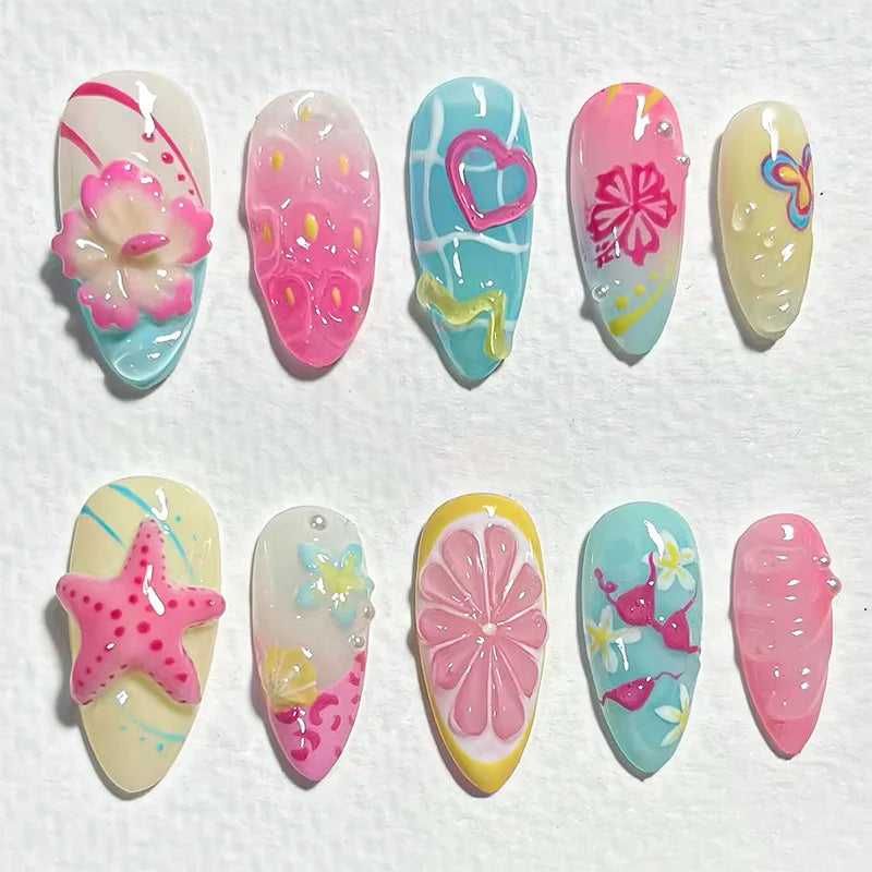 A set of 8 press-on nails featuring various gradient colors and floral designs including pink, blue, and yellow.