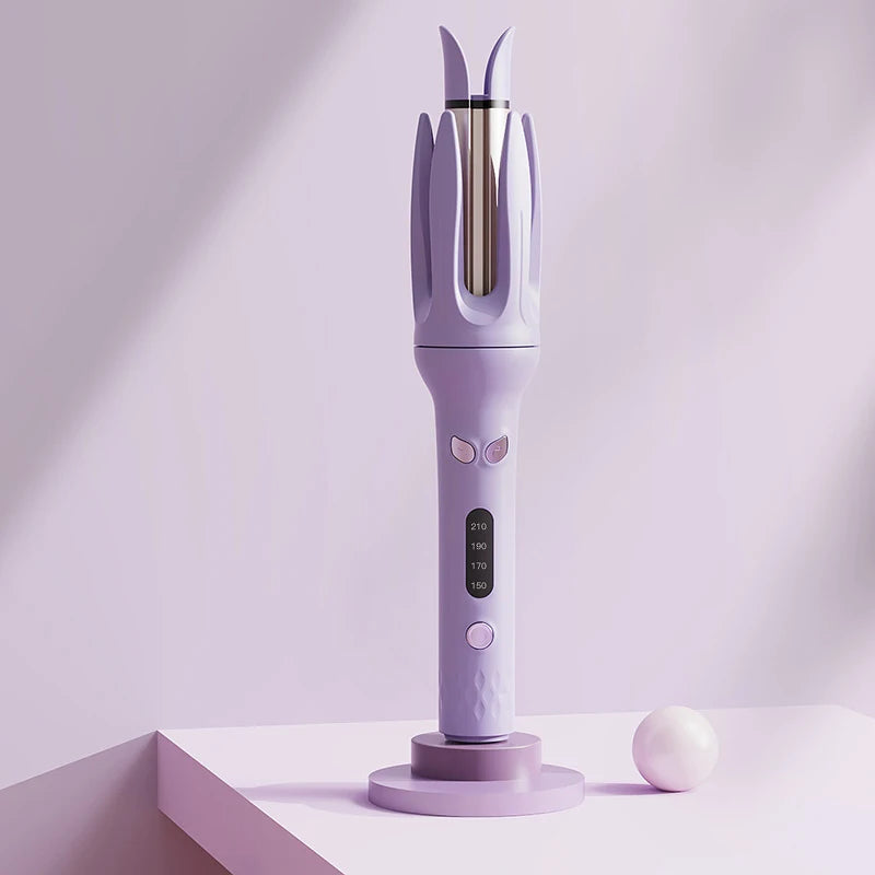A purple automatic ceramic hair curler with a metallic nozzle is displayed on a white surface.