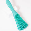 A teal adjustable detangling hair brush with widely spaced bristles is shown on a white background.