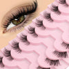 A close-up of pink false eyelashes displayed on a plastic tray, showing various lash styles.
