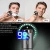A close-up of a silver electric shaver showing a battery level display of 99% for wet and dry shaving.