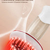 A close-up of a red light irradiation electric meridian brush being used on the skin.