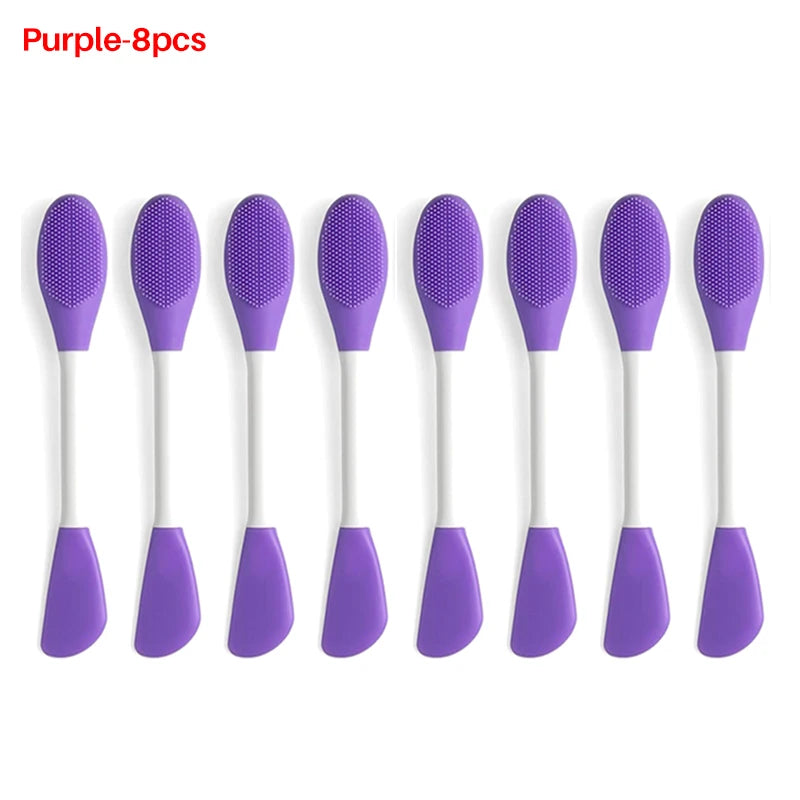 A set of eight purple silicone facial brushes for exfoliation