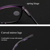 Close-up of purple progressive multifocal reading glasses showing the spring hinge and curved mirror legs.