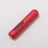 A sleek, metallic red portable refillable perfume bottle viewed from the side.