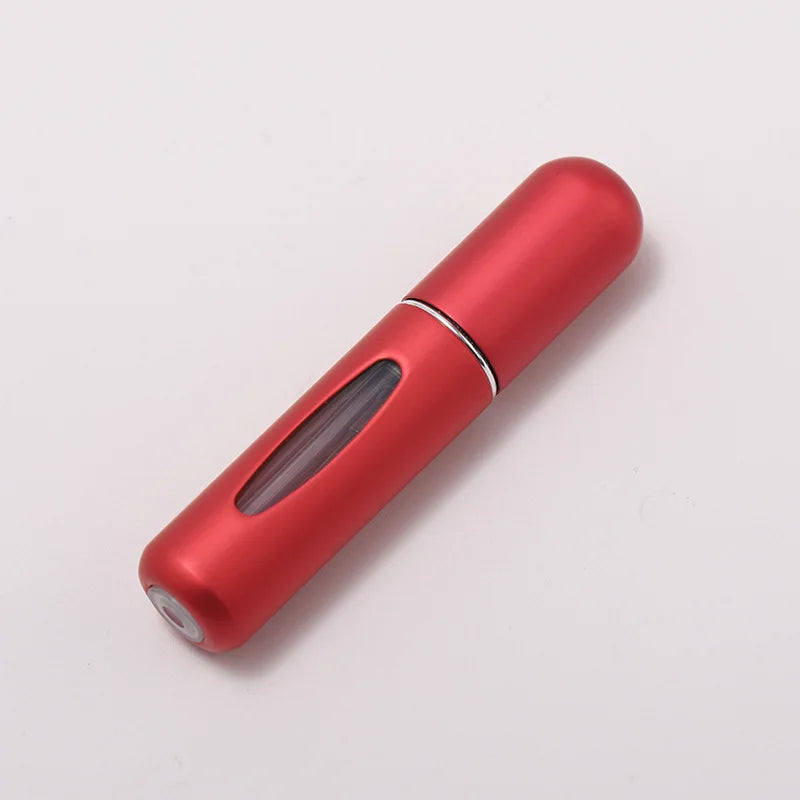 A sleek, metallic red portable refillable perfume bottle viewed from the side.