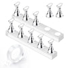A set of silver magnetic nail art display stands and a clear ring displayed on a white plastic stand.
