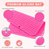 Pink silicone mat with ridges and a hanging hole designed for non-slip surface and easy cleaning