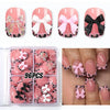 A set of 96 leopard print press-on nails in pink and black with white bow accents displayed on fingernails.