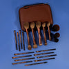 A brown makeup brush set with a matching travel case is displayed on a blue surface.