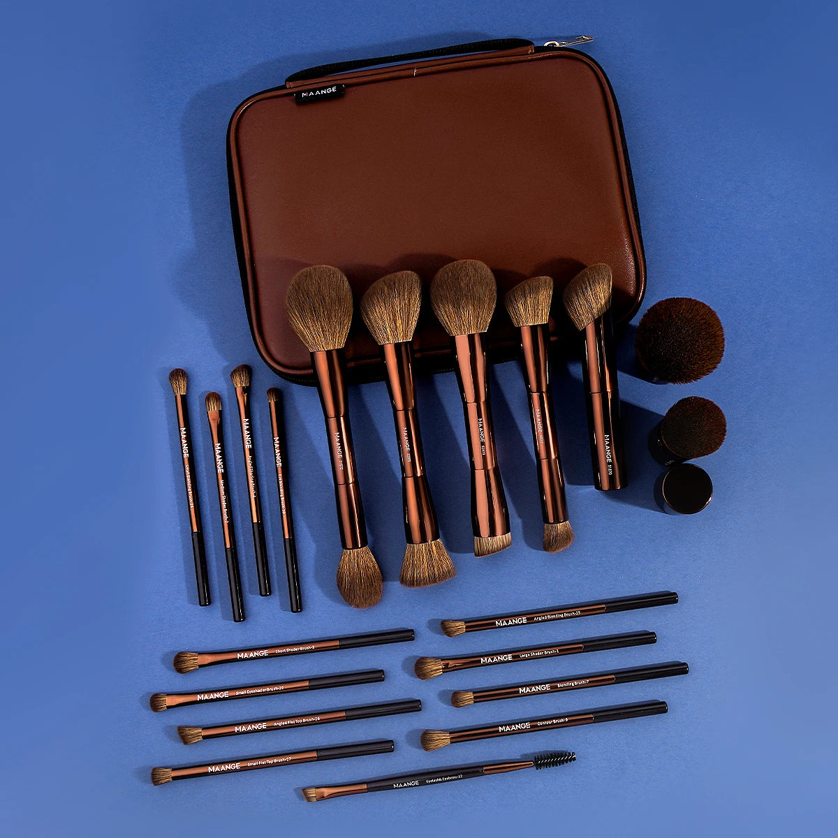 A brown makeup brush set with a matching travel case is displayed on a blue surface.