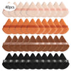 A set of cosmetic powder puffs in various colors including pink, orange, brown, and black.