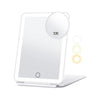 A white LED rechargeable travel makeup mirror with a 10X magnification lens resting on a stand.