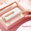 A hand is placing an IPL hair removal device in a pink box with a satin ribbon, suggesting it as a perfect gift.