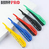 A collection of various colored folding shaving razors displayed on a white background.