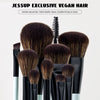 A set of six black makeup brushes with brown bristles displayed against a white background.