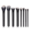 A set of eight black makeup brushes with fluffy synthetic hair displayed vertically.