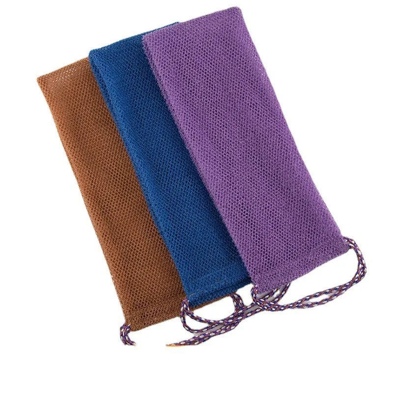 Three exfoliating body scrub sponges in brown, blue, and purple mesh