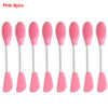 A set of eight pink silicone facial brushes for exfoliation
